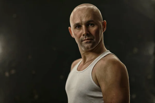 athlete in a shirt photo in studio / isolate on a black background, athlete in a white t-shirt