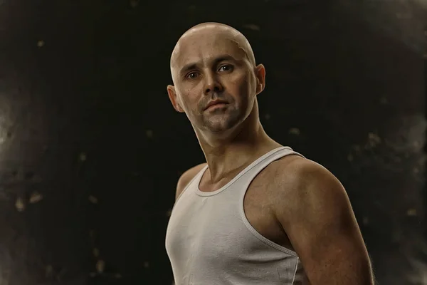 athlete in a shirt photo in studio / isolate on a black background, athlete in a white t-shirt