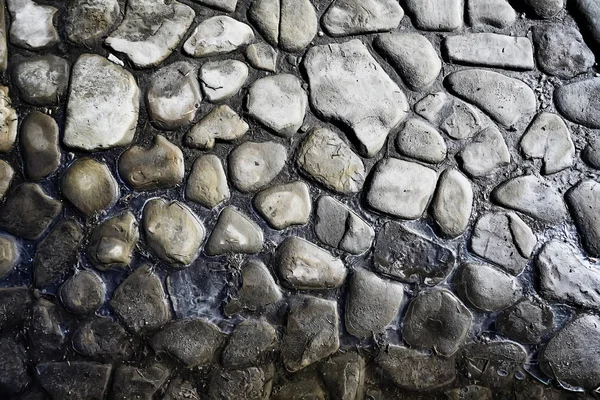 old stone pavement background / abstract pavement, large cobblestones, old road texture