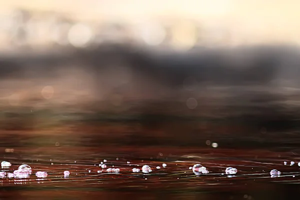 abstract background ripples on water / brown stream, water texture brown color on the swamp, peat