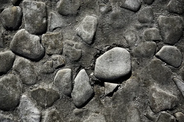 old stone pavement background / abstract pavement, large cobblestones, old road texture