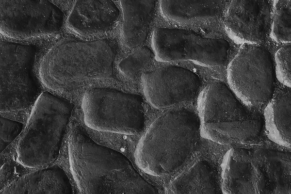 old stone pavement background / abstract pavement, large cobblestones, old road texture