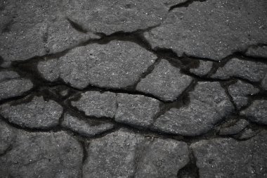 asfalt yolda çatlaklar doku / soyut arka plan çatlakları asfalt asfalt