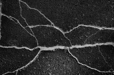 asfalt yolda çatlaklar doku / soyut arka plan çatlakları asfalt asfalt