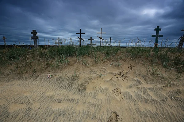 grave crosses in a desert cemetery / climate change concept warming, disaster, apocalypse, Christian cemetery