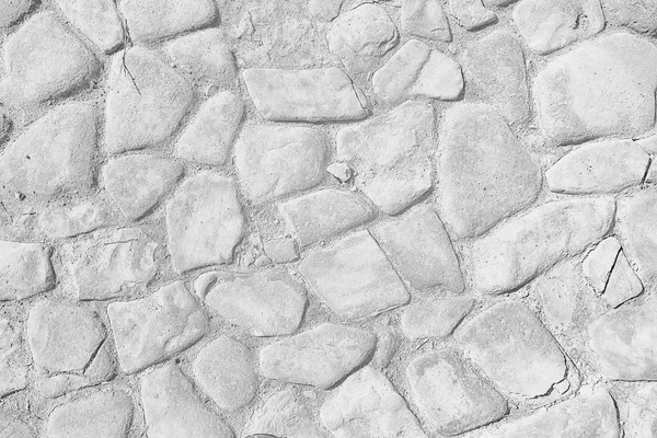 old stone pavement background / abstract pavement, large cobblestones, old road texture