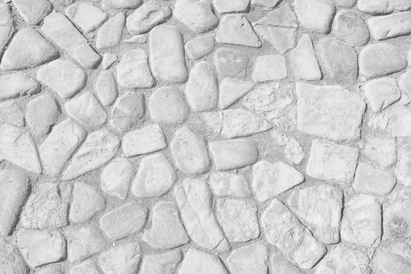 old stone pavement background / abstract pavement, large cobblestones, old road texture