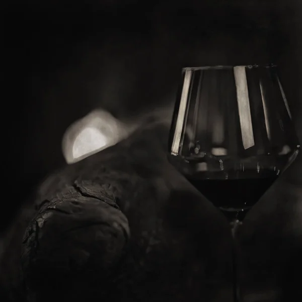 glass of red wine / vintage background, old cask wine, alcohol tasting