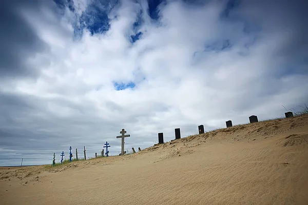 grave crosses in a desert cemetery / climate change concept warming, disaster, apocalypse, Christian cemetery