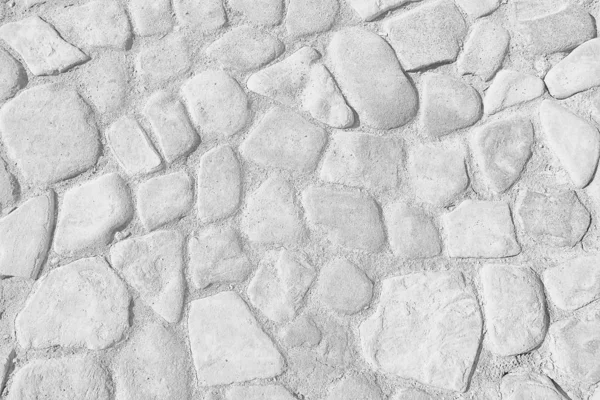 old stone pavement background / abstract pavement, large cobblestones, old road texture