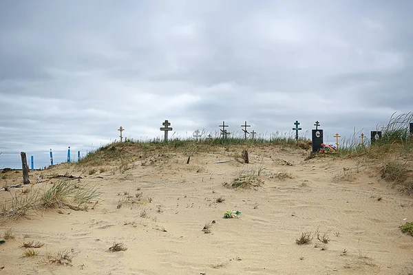 grave crosses in a desert cemetery / climate change concept warming, disaster, apocalypse, Christian cemetery