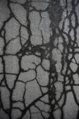 asfalt yolda çatlaklar doku / soyut arka plan çatlakları asfalt asfalt