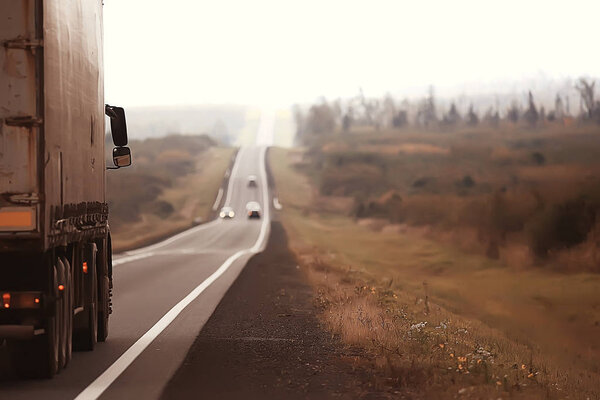 gloomy autumn road / seasonal view highway, autumn road landscape, transportation concept