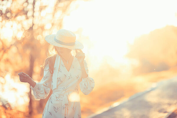 girl in a straw hat portrait spring freedom / concept spring view model happy people