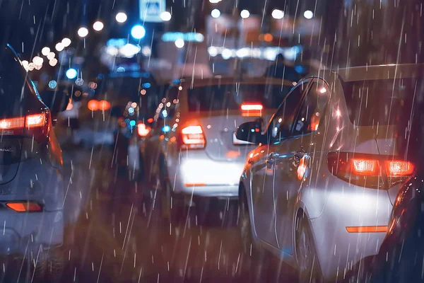 night rain cars lights / autumn road in the city, traffic October on the highway, dark evening traffic jams