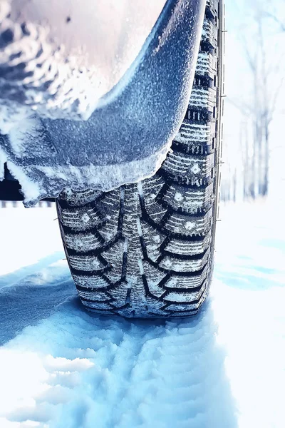 winter tires with spikes on the snow / transport road northern wheels, climate winter season