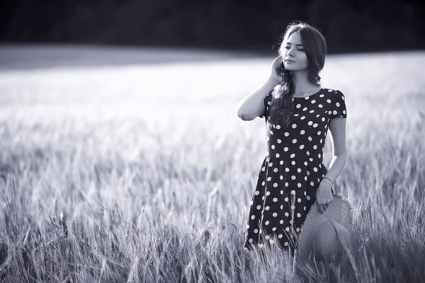Girl dress wheat field / happy summer vacation concept, one model in a sunny field