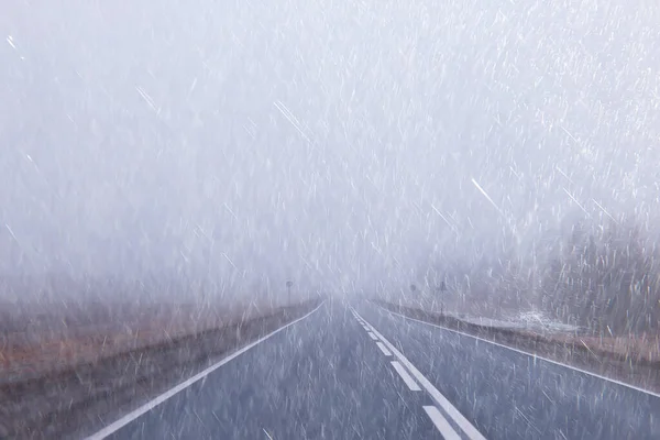 autumn landscape highway rain and fog in europe, dangerous road, bad weather