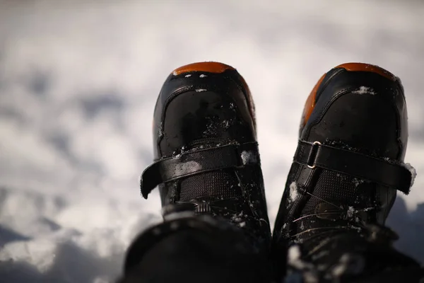 A snow boot close up. Shot of a snow on white snow background. — Stock Photo, Image