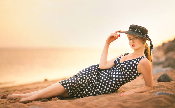 Happy Carefree Woman Enjoying Beautiful Sunset on the Beach