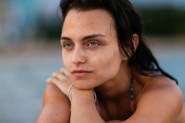 Beautiful fit surfing girl on surfboard on in the ocean. Woman ride good wave.