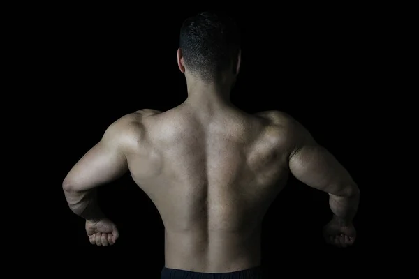Человек Показывает Результат Упражнений Спине Черный Фон — стоковое фото