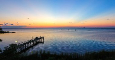 Sunset at Mobile Bay in Daphne, Alabama  clipart