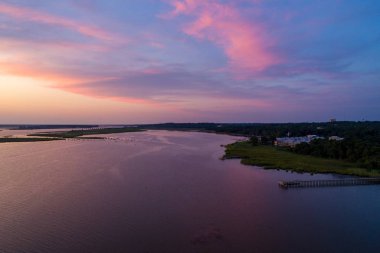 Sunset on Mobile Bay from Daphne, Alabama Bayfront Park in July 2019. clipart