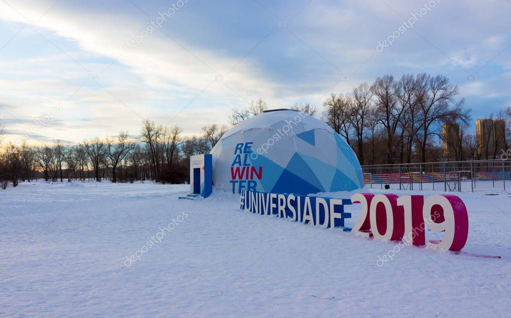 Krasnoyarsk, Russia - 7 January, 2019: a hashtag sign Universiade 2019 at Tatyshev island. XXIX Winter Universiade in the city of Krasnoyarsk.