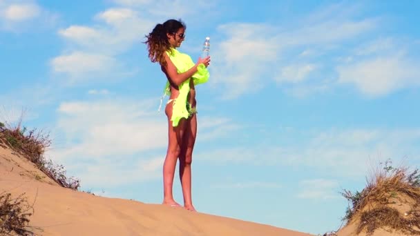 Slow Motion Young Girl Standing Beach Drinking Water — Stock Video