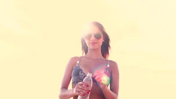 Slow Motion Young Girl Opening Bottle Water Yellow Background — Stock Video