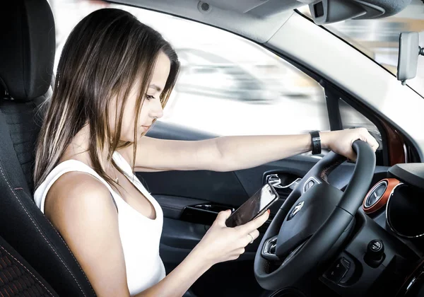 Young Woman Holding Mobile Phone While Driving Car Female Driver — 스톡 사진