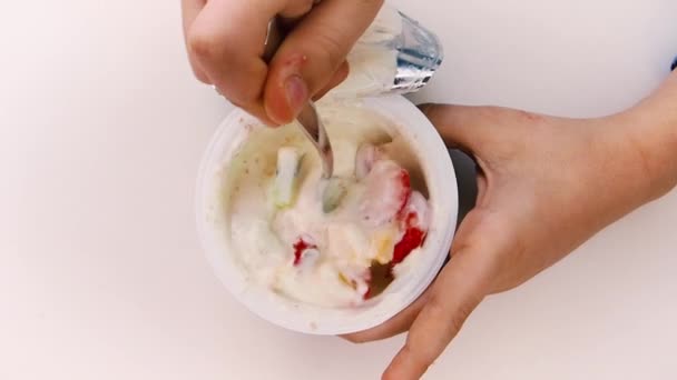 Closeup Children Hands Taking Plastic Cup Fruits Yogurt White Background — Stock Video