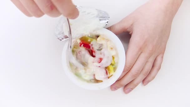 Closeup Children Hands Taking Plastic Cup Fruits Yogurt White Background — Stock Video