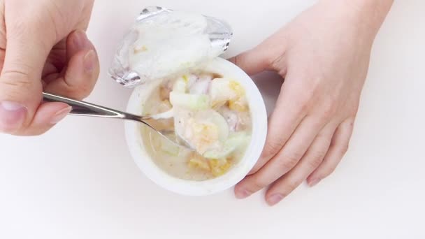 Closeup Children Hands Taking Plastic Cup Fruits Yogurt White Background — Stock Video