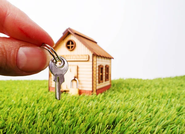 Colorful Wooden Miniature House Green Grass Foreground Hand Key New — Stock Photo, Image