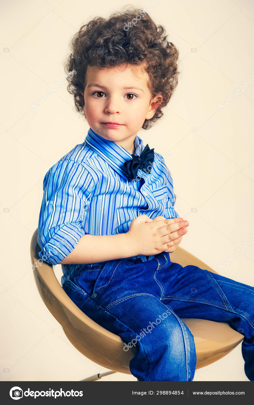 depositphotos_298894854-stock-photo-kid-portrait-curly-hair-studio.jpg