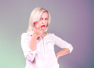 Pissed off by an angry angry middle-aged pessimistic woman with a bad attitude of thinking looks at you Negative emotions of a person's facial expression of a feeling of reaction