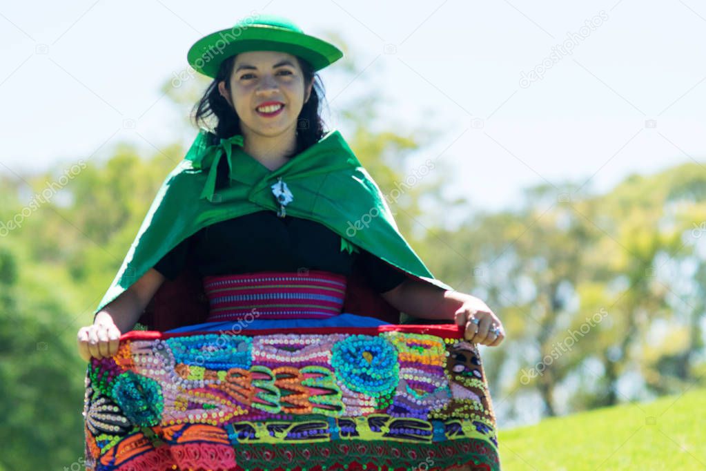 Portrait of a young woman dancing Huayno, a traditional musical genre typical of the Andean region of Peru, Bolivia, northern Argentina and northern Chile