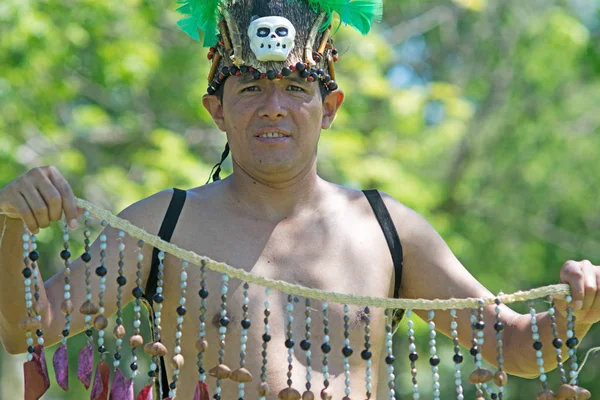 Portrait of a man wearing traditional Peruvian clothing and dancing Anaconda dance, a musical genre typical of Amazon region of Peru