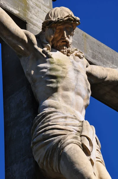 View of the a Jesus Statue in the Calvario of Tandil City in Buenos Aires, Argentina against blue sk