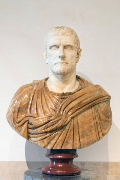 Ancient sculpture of a roman senator in the the public Baths of Diocletian in Rome, Italy. It was built from 298 to 306