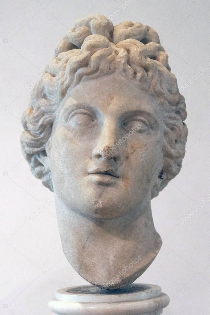 Ancient sculpture of the head of Apollo in the baths of Diocletian (Thermae Diocletiani) in Rome. Italy