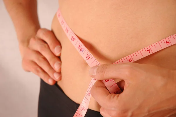 Woman Measuring Waist Using Tape Measure — Stock Photo, Image