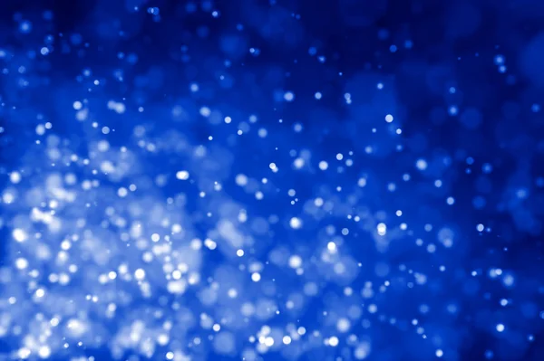 Lumières scintillantes abstraites fond bleu déconcentré — Photo