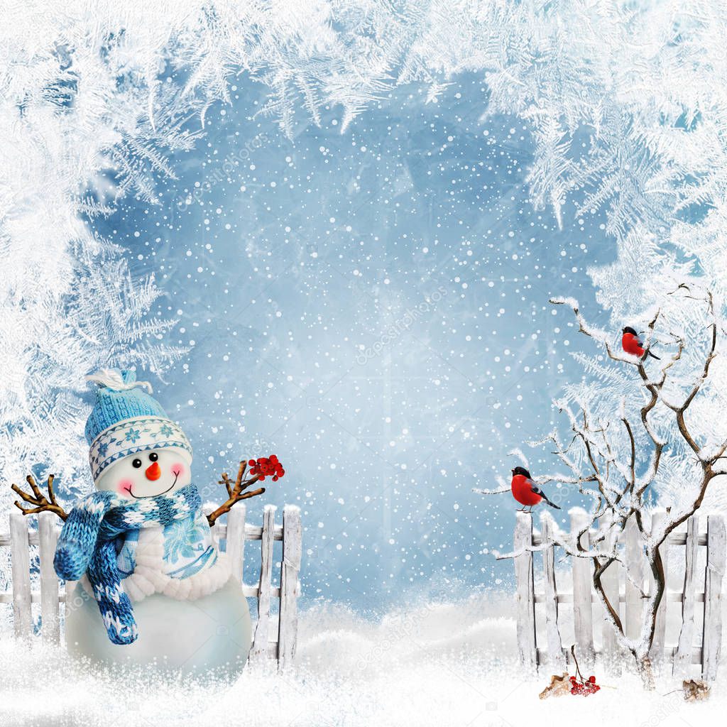 Christmas greeting background with a snowman near the fence and bullfinches on the branches of a tree