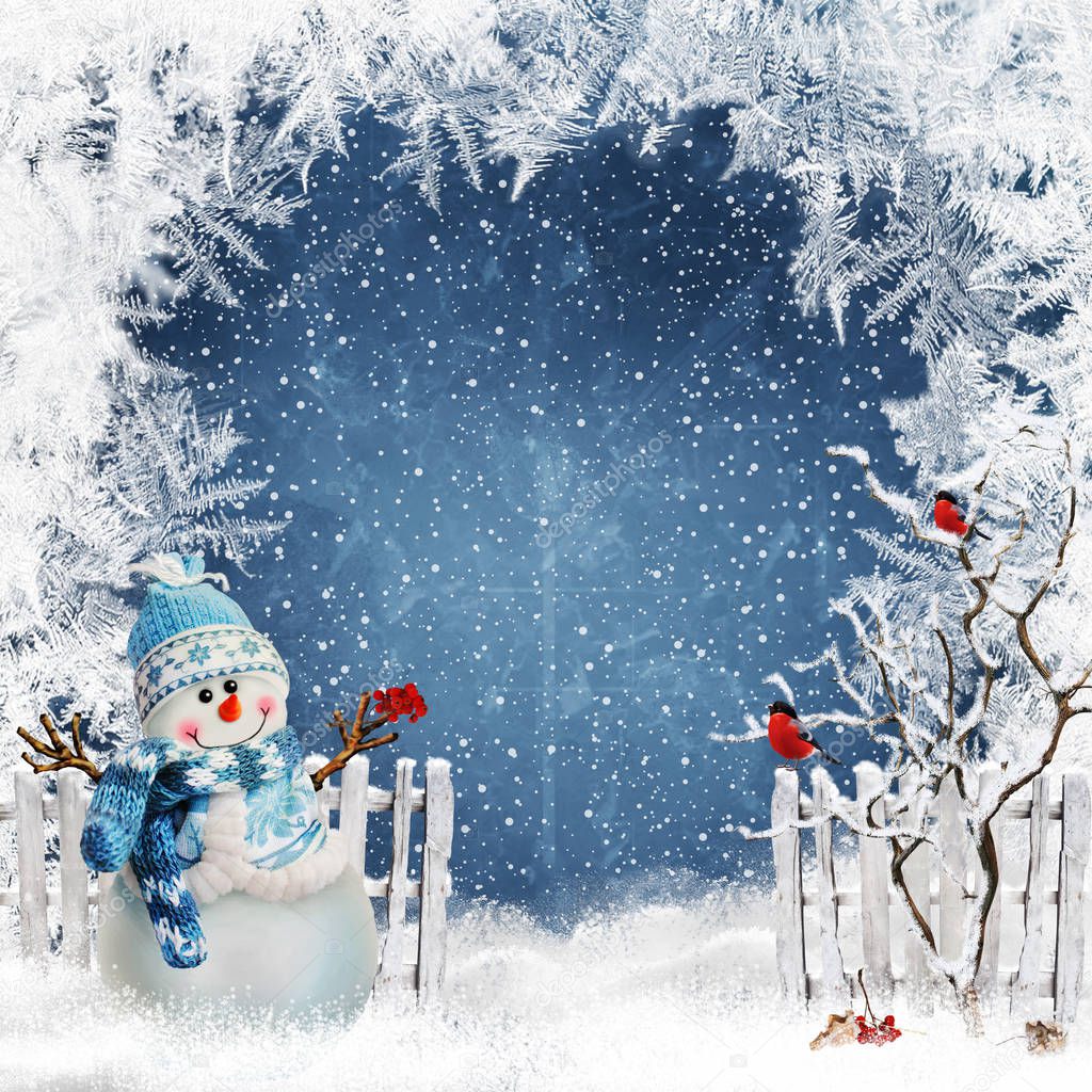 Christmas greeting background with a snowman near the fence and bullfinches on the branches of a tree