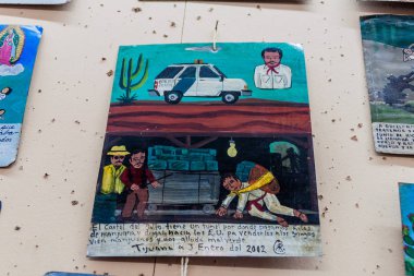 Antigua, Guatemala - 26 Mart 2016: Retablo (Lamine), Meksikalı bir halk sanat adanmışlık resim. Cartel ABD içine uyuşturucu kaçakçılığı hakkında.