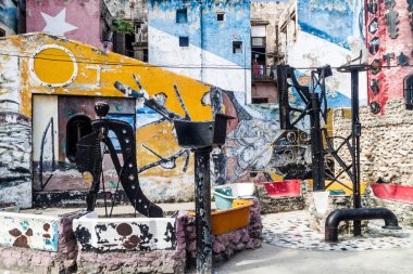 HAVANA, CUBA - FEB 20, 2016: Street art in Callejon de Hamel in Havana Centro neighborhood clipart