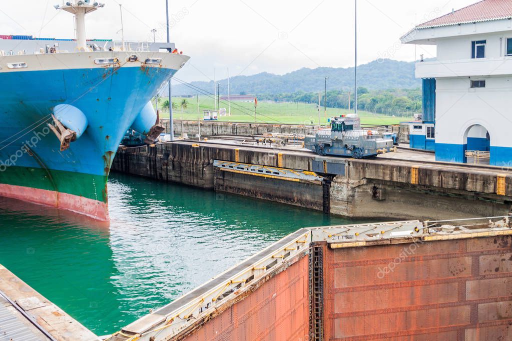 Ship is  passing through Gatun Locks, part of Panama Canal.